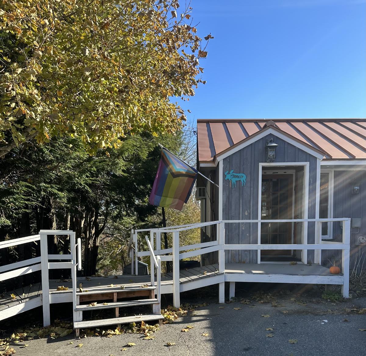 The front door of Kenshin Ranch, with a Progress Pride flag